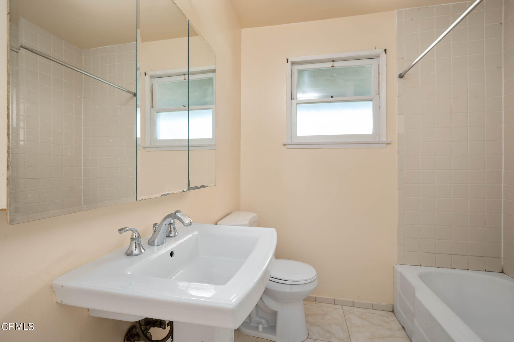 19406 Sherman Way Reseda, CA 91335 - Photo 19 of 36 a bathroom with a sink toilet and shower