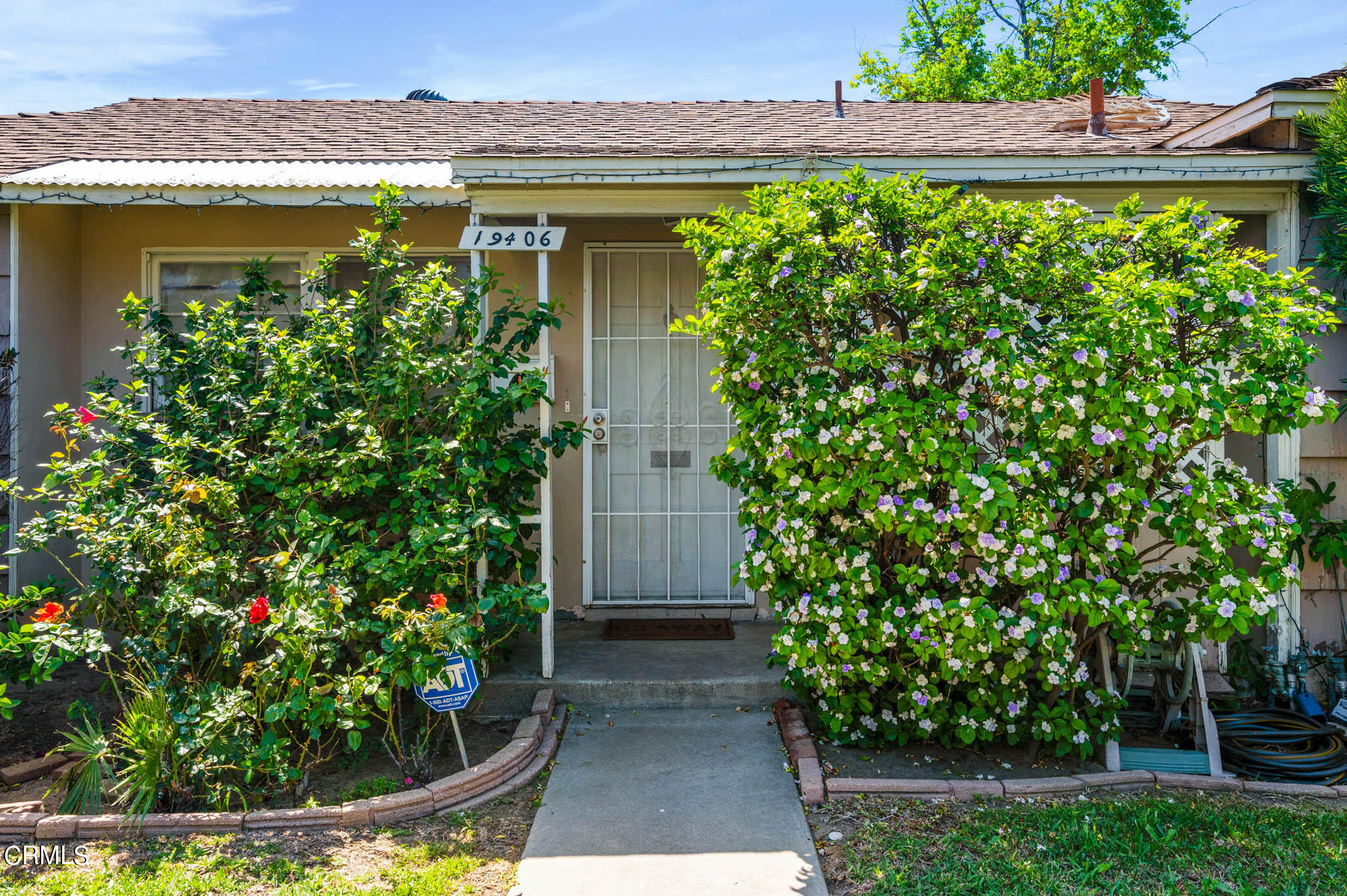19406 Sherman Way Reseda, CA 91335 - Photo 2 of 36 a view of a garden with pathway