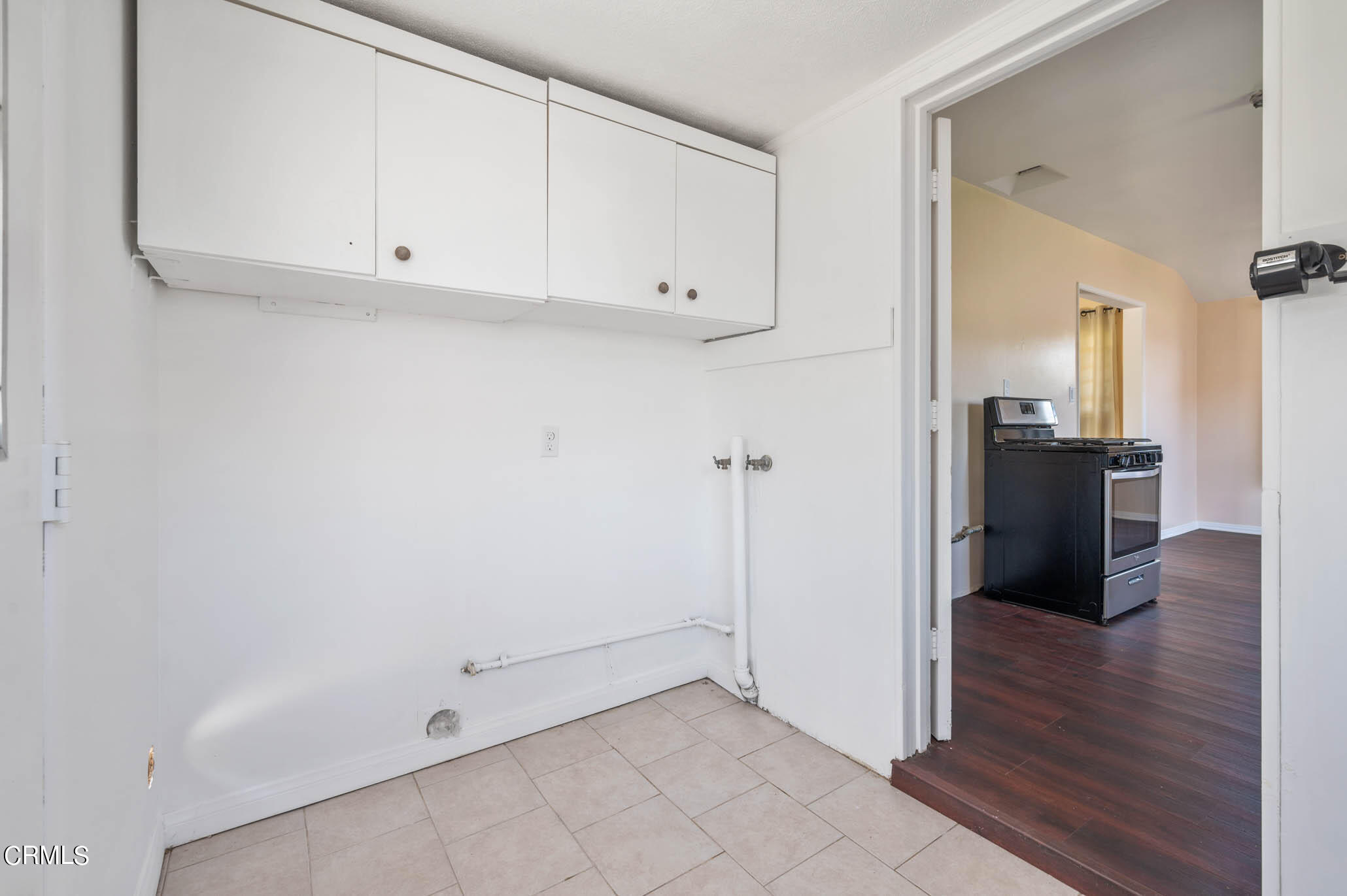 19406 Sherman Way Reseda, CA 91335 - Photo 26 of 36 a view of a livingroom with wooden floor