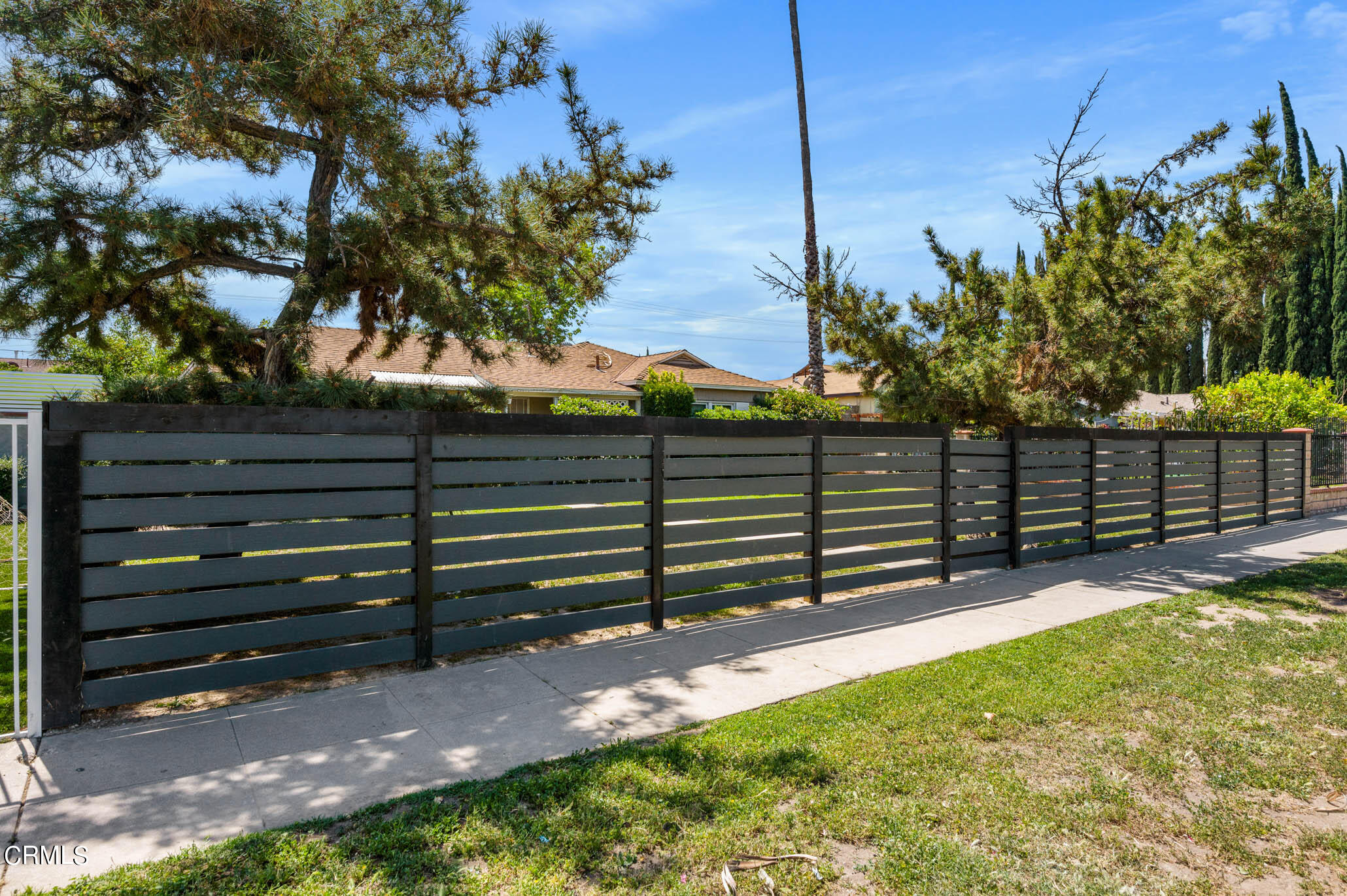 19406 Sherman Way Reseda, CA 91335 - Photo 3 of 36 a view of a house with a fence