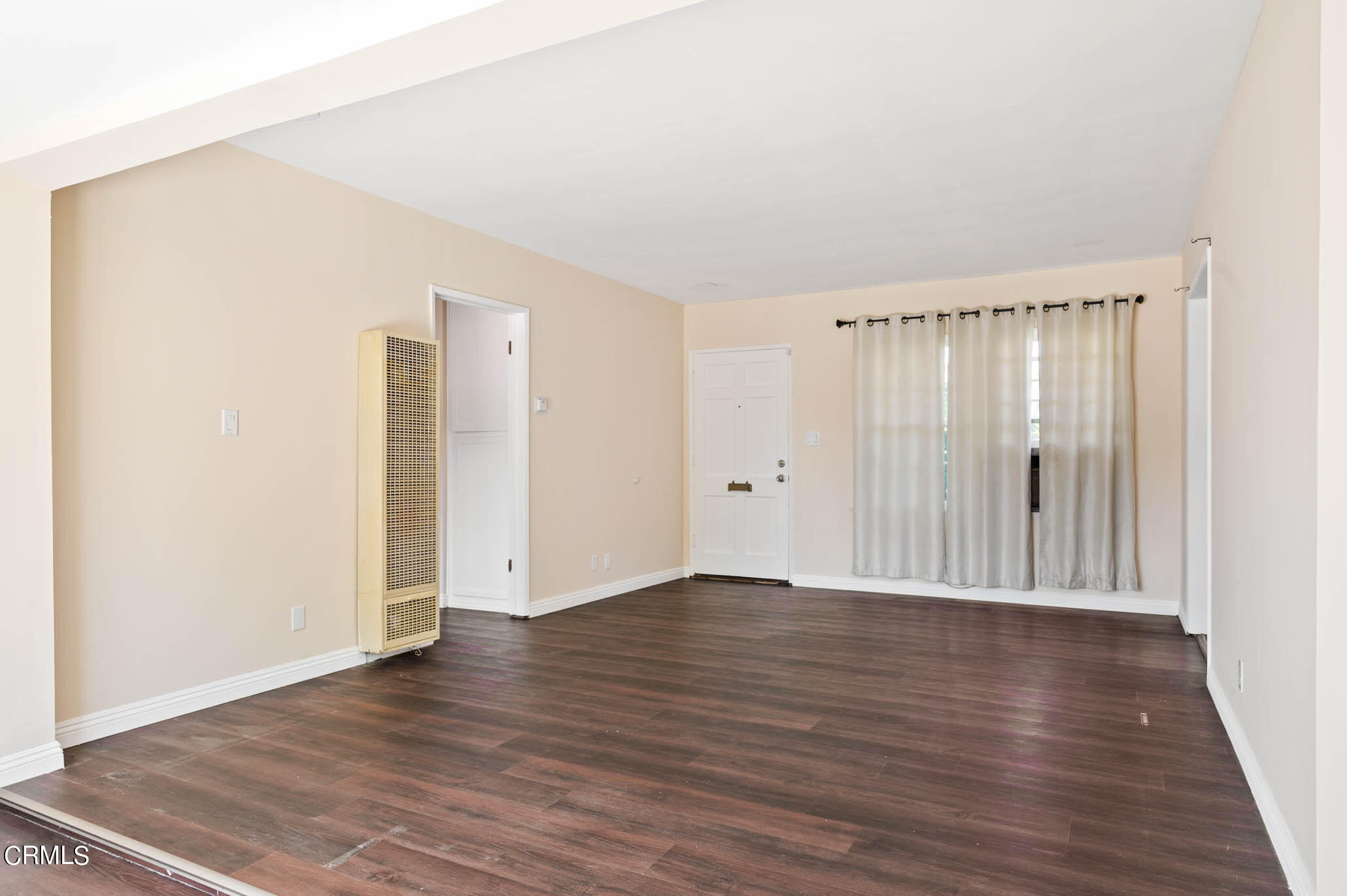 19406 Sherman Way Reseda, CA 91335 - Photo 9 of 36 a view of an empty room with wooden floor