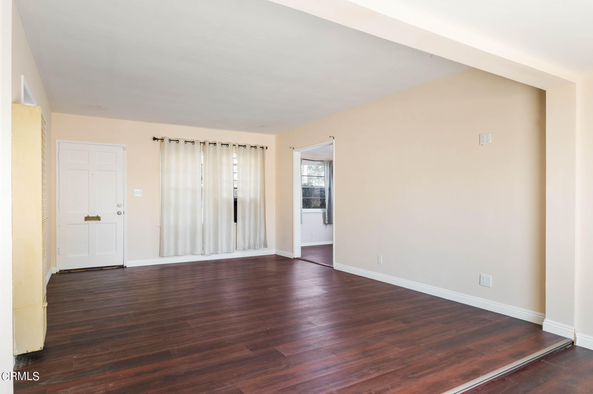 19406 Sherman Way Reseda, CA 91335 - Photo 10 of 36 a view of an empty room with wooden floor