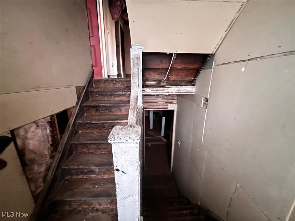 1888 Beersford Road Cleveland, OH 44112 - Photo 7 of 22 View of staircase leading to upstairs bedrooms