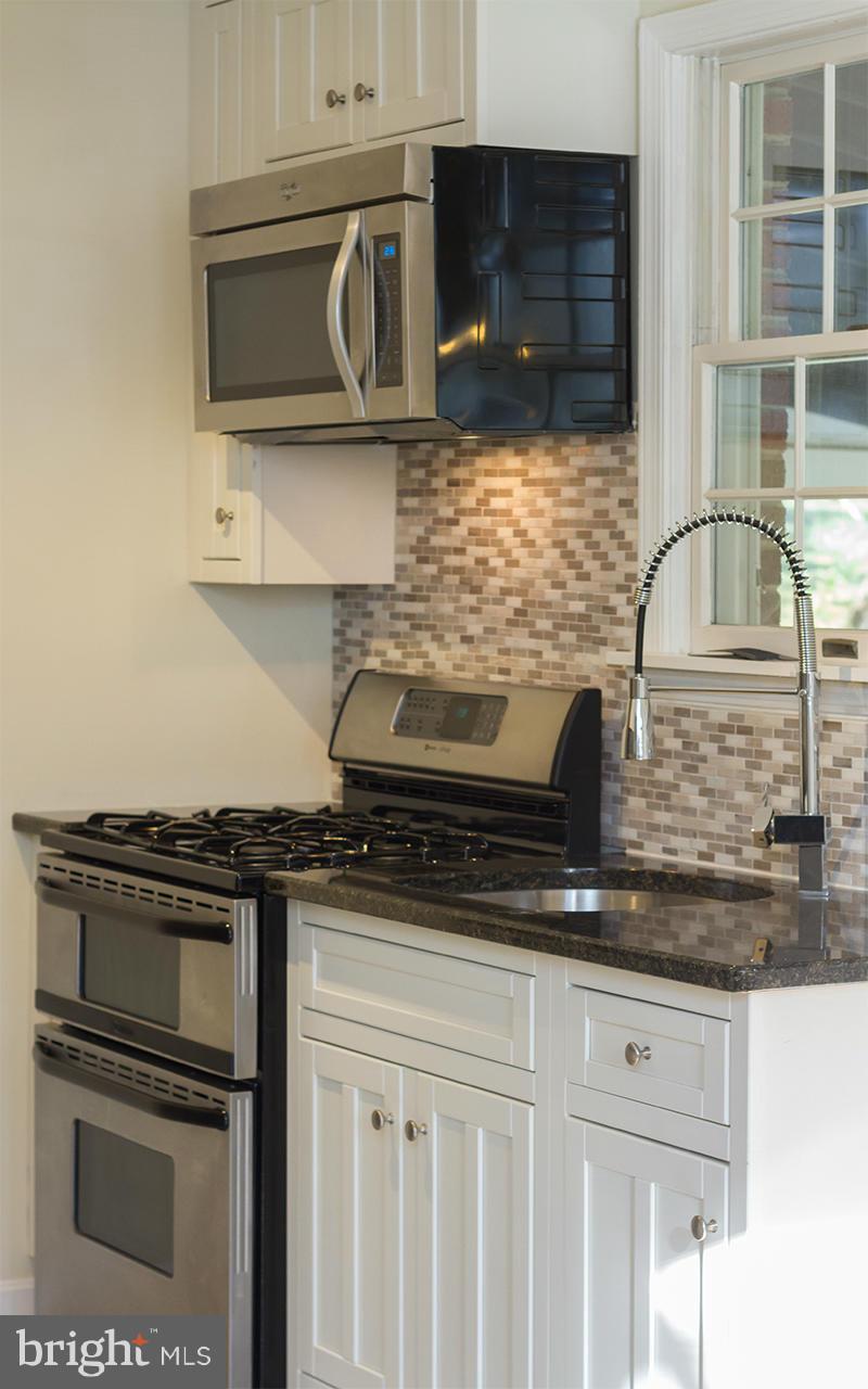 8103 Rider Avenue Baltimore, MD 21204 - Photo 9 of 30 Brand new kitchen with white cabinetry