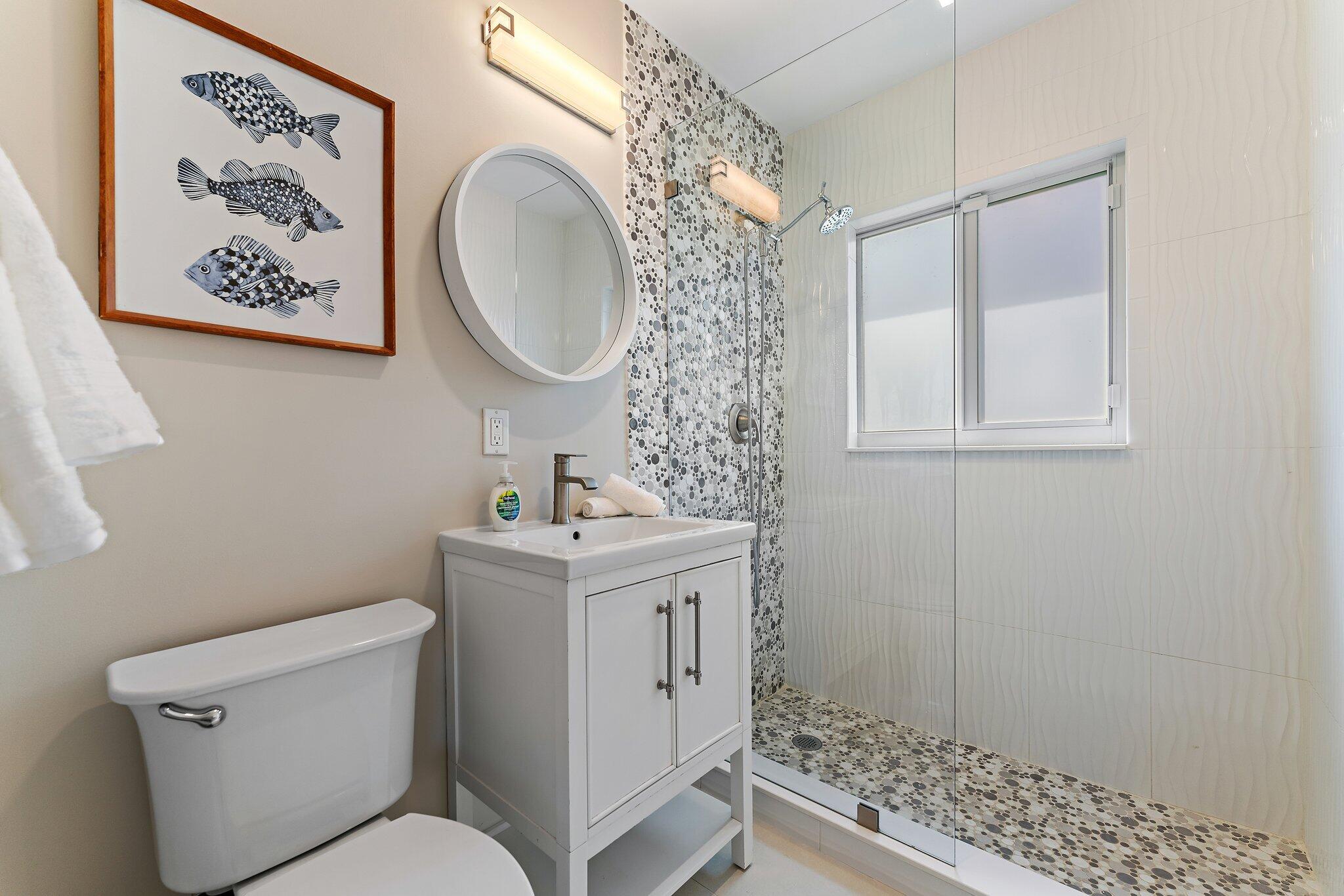 4300 Washington Road West Palm Beach, FL 33405 - Photo 18 of 27 a bathroom with a toilet sink and mirror