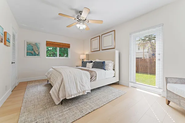 a bedroom with bed and a window