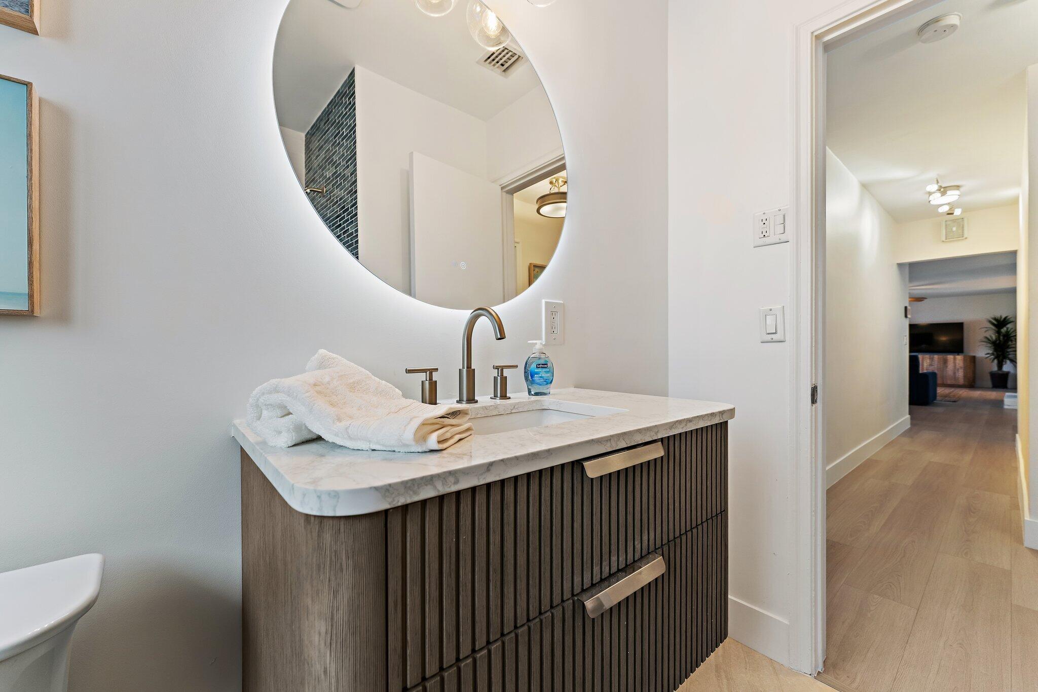 4300 Washington Road West Palm Beach, FL 33405 - Photo 25 of 27 a bathroom with a sink and a mirror