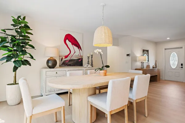 a view of a dining room with furniture window and outside view