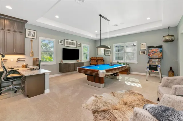 a spacious bathroom with a double vanity sink a large mirror and a shower