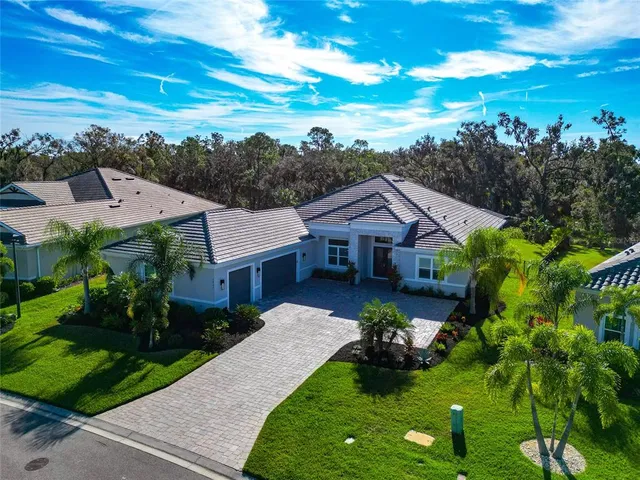 a front view of house with yard and green space