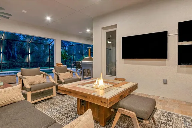 an aerial view of residential houses with outdoor space and swimming pool