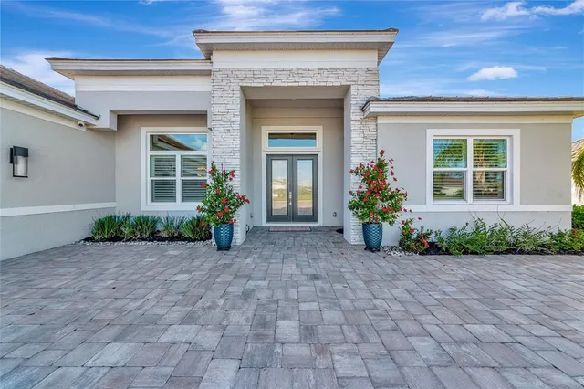 a view of a livingroom with furniture and a potted plant