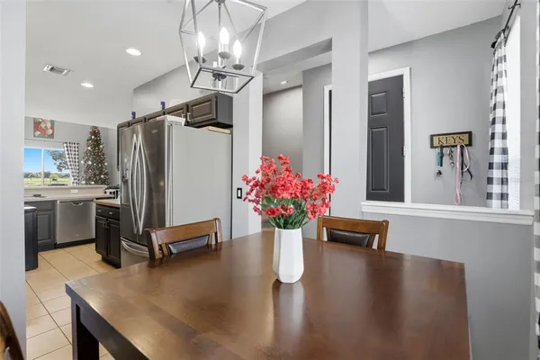 a kitchen with a refrigerator and countertop