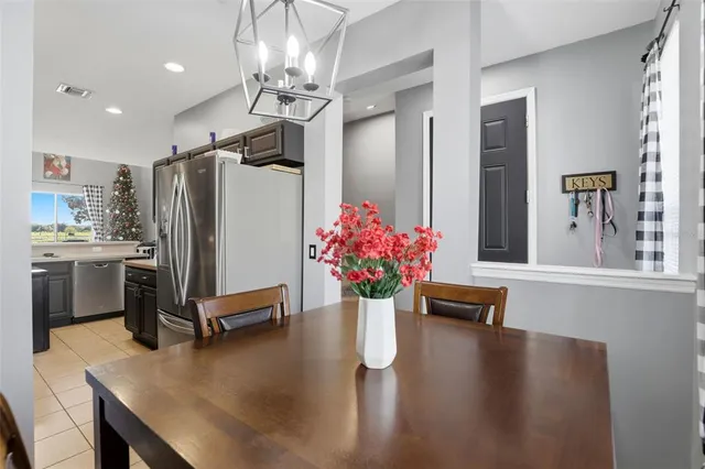 a kitchen with a refrigerator and countertop