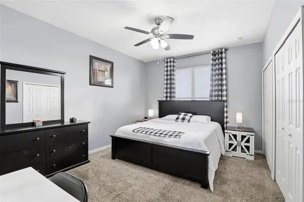 a bedroom with a bed and a dresser