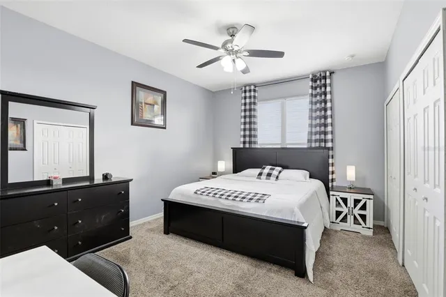 a bedroom with a bed and a dresser