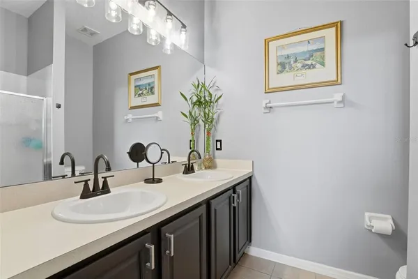 a bathroom with a sink a vanity and a mirror