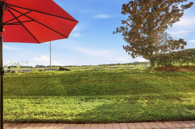 a view of a field with an ocean view
