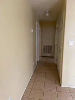 a view of hallway with door