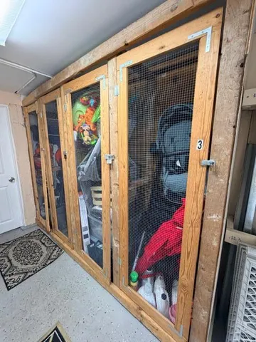 a view of a hallway with wooden floor and windows