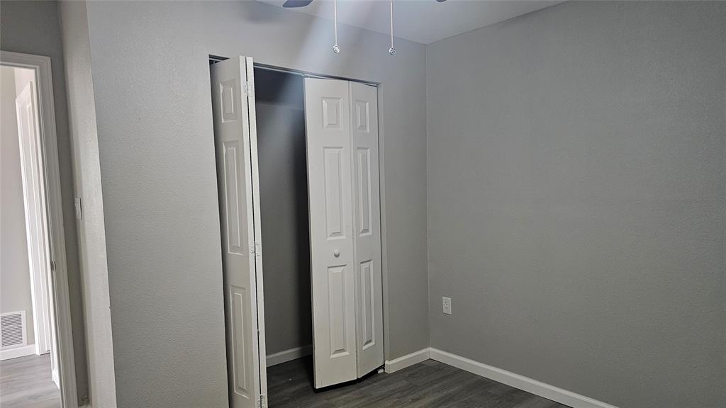 1624 Cedar Street Bonham, TX 75418 - Photo 3 of 8 a view of empty room with wooden floor