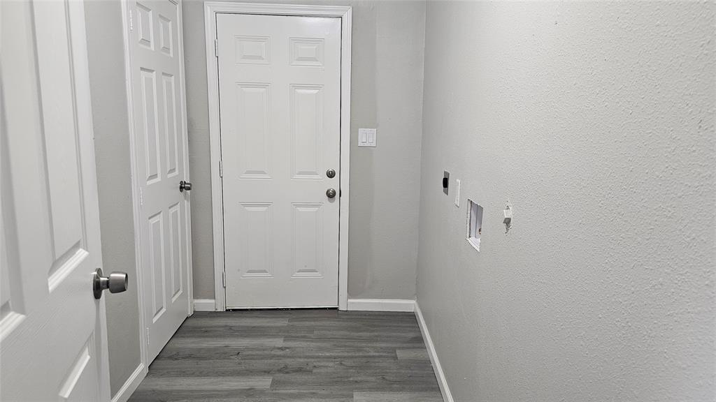 1624 Cedar Street Bonham, TX 75418 - Photo 6 of 8 a view of a hallway with wooden floor