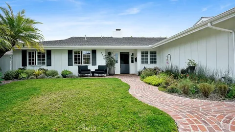 a view of a house with garden and yard