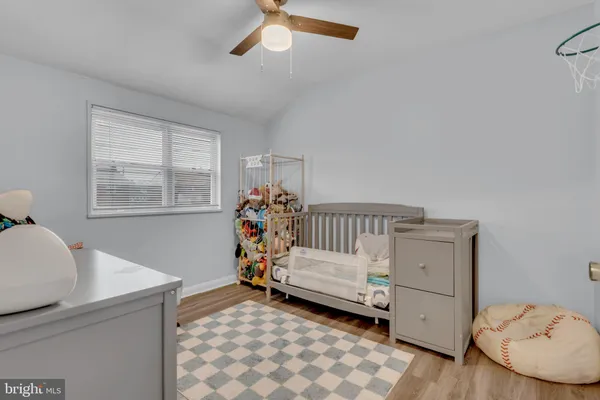 a bed room with a bed and a dresser
