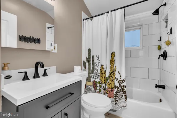 a bedroom with furniture and a lamp