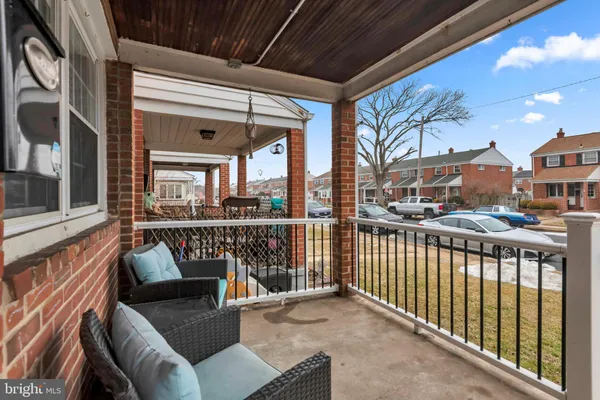 a view of a balcony with furniture