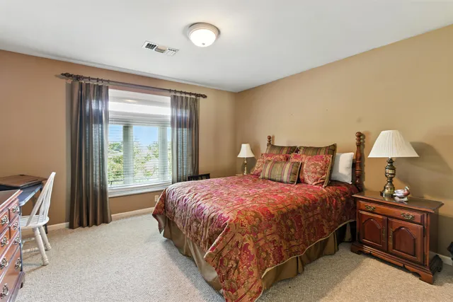 a bedroom with a bed and window