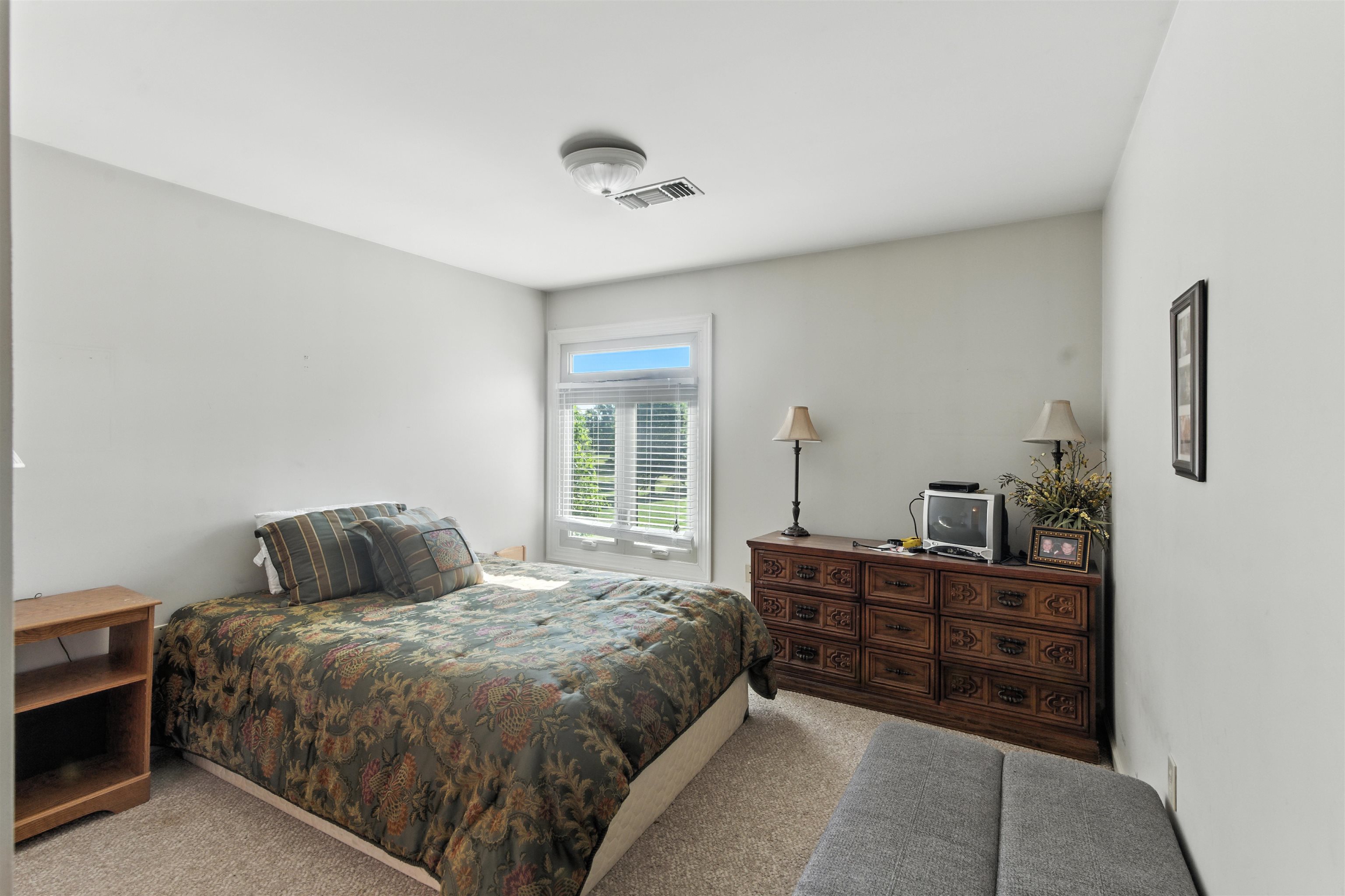 1452 Solo Road Covington, TN 38019 - Photo 26 of 39 a bedroom with a bed and a dresser