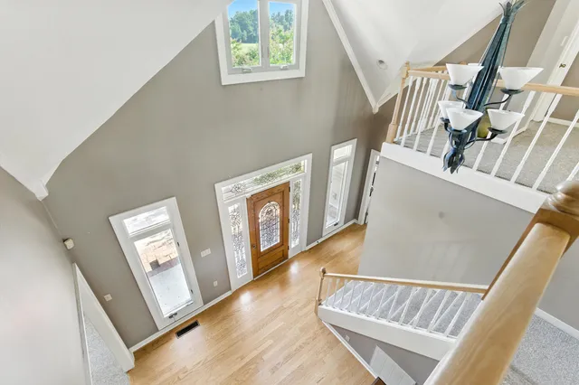 a view of an entryway with wooden floor