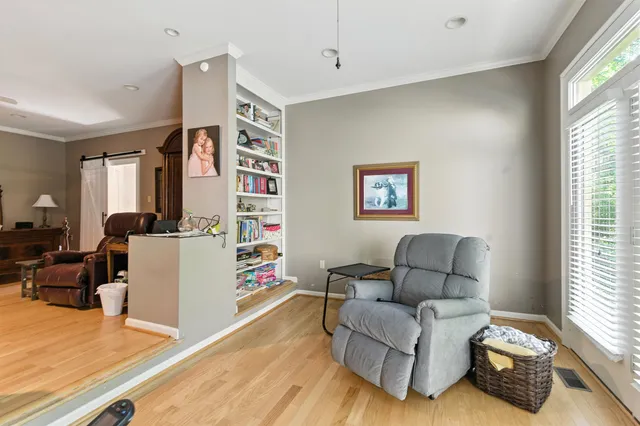 a living room with furniture and a window