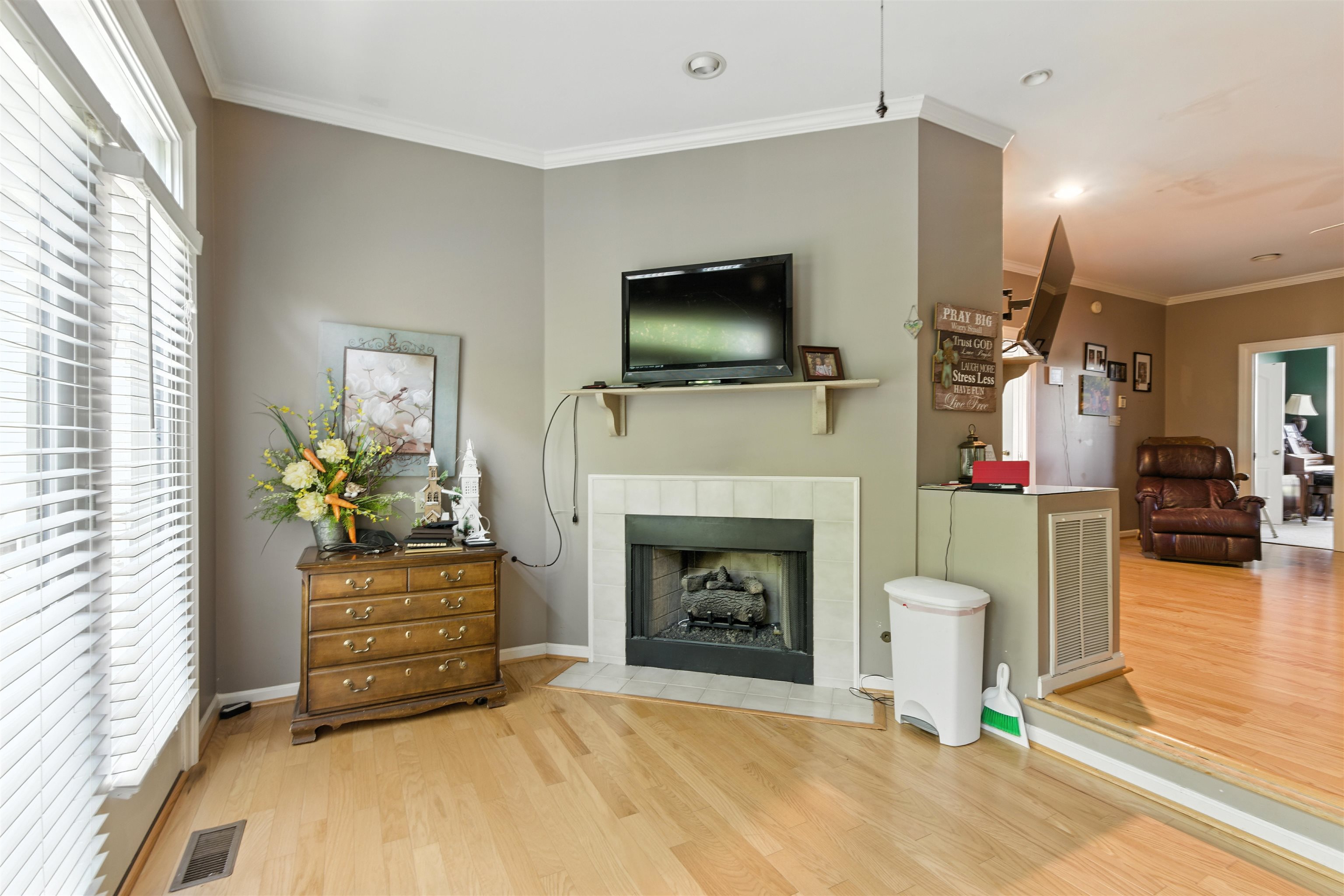 1452 Solo Road Covington, TN 38019 - Photo 36 of 39 a living room with furniture a flat screen tv and a fireplace