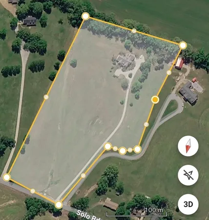 a living room with furniture fireplace and a large window