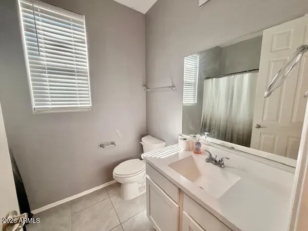 a bathroom with a sink toilet and vanity