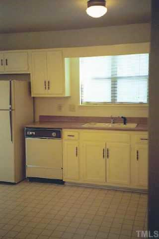 Kitchen has a pantry and room for a table for two. Other