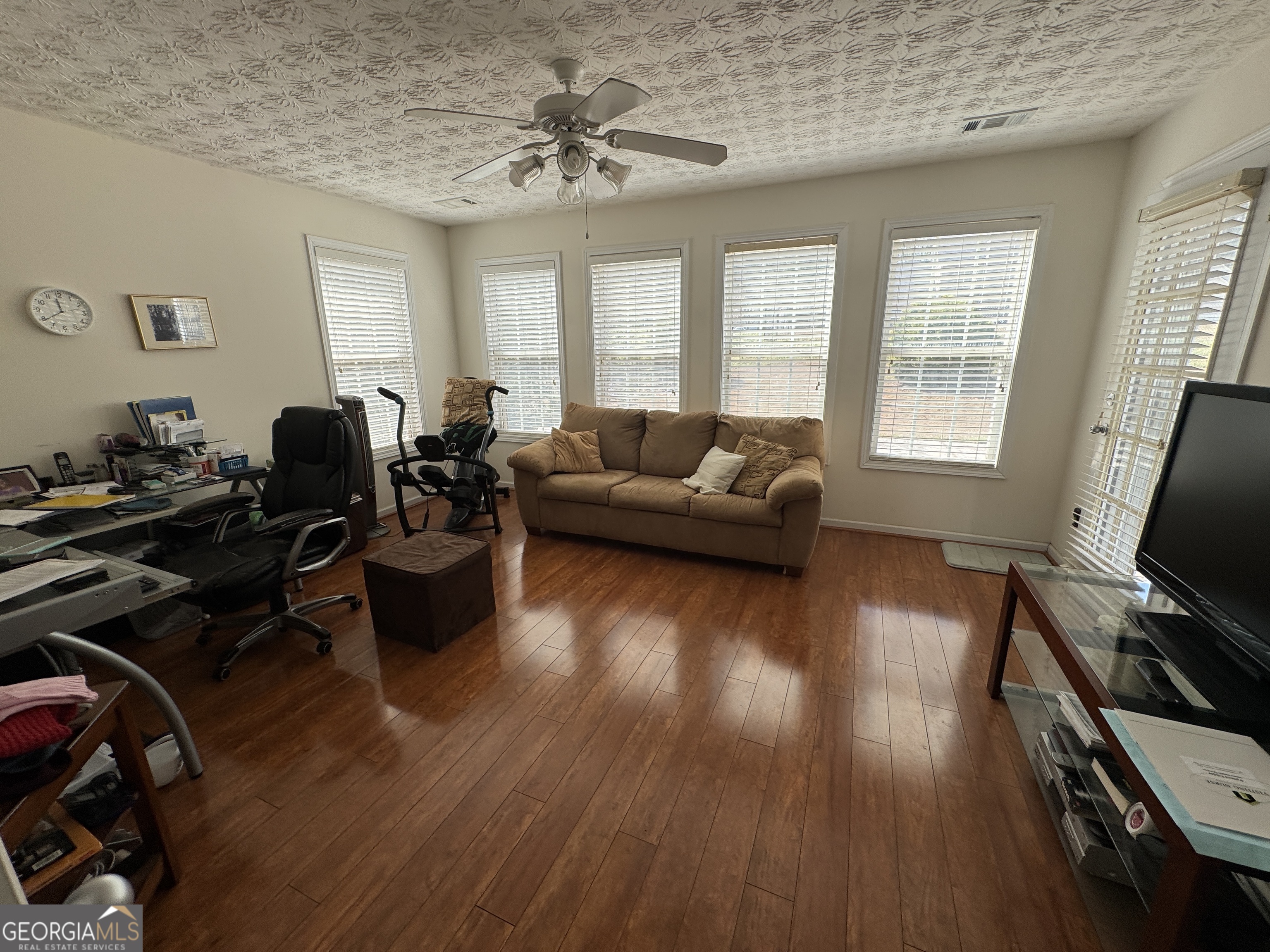 36 Windcrest Terrace Covington, GA 30016 - Photo 13 of 32 a living room with furniture and wooden floor