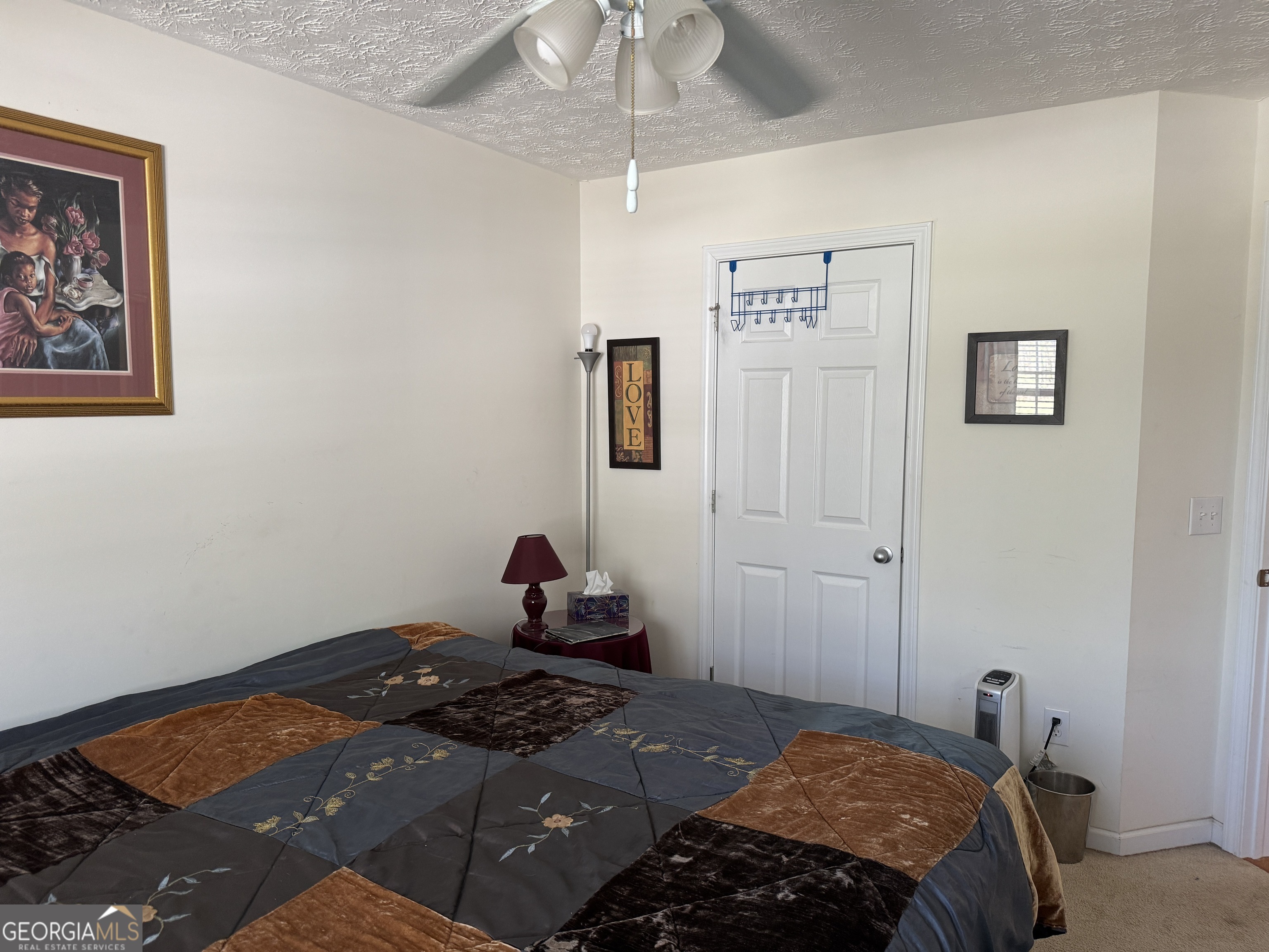 36 Windcrest Terrace Covington, GA 30016 - Photo 16 of 32 a bedroom with a bed and the view of bathroom