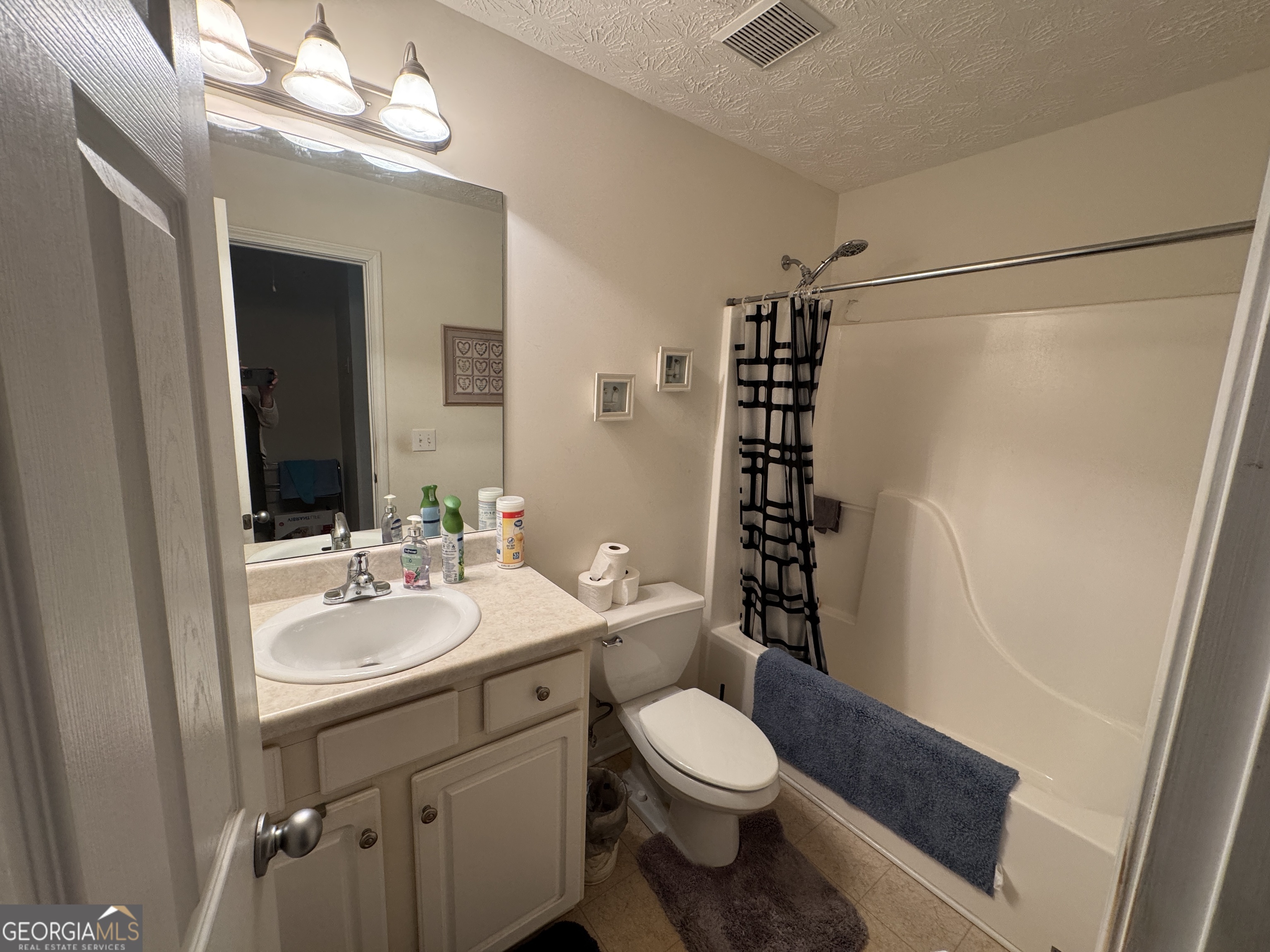 36 Windcrest Terrace Covington, GA 30016 - Photo 18 of 32 a bathroom with a sink a toilet and shower