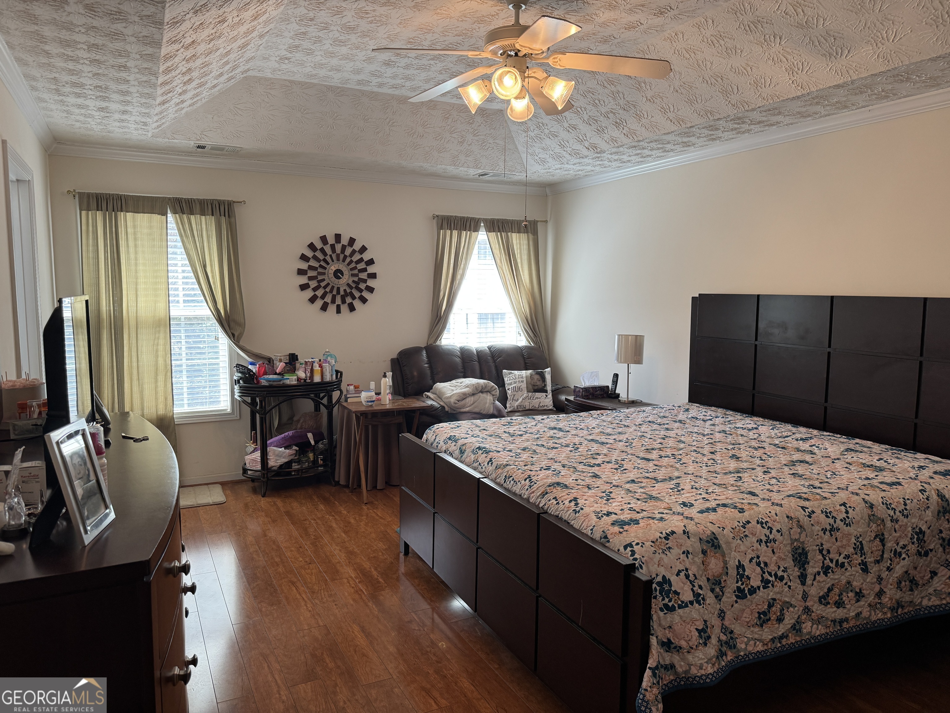 36 Windcrest Terrace Covington, GA 30016 - Photo 21 of 32 a bedroom with a bed and a chandelier