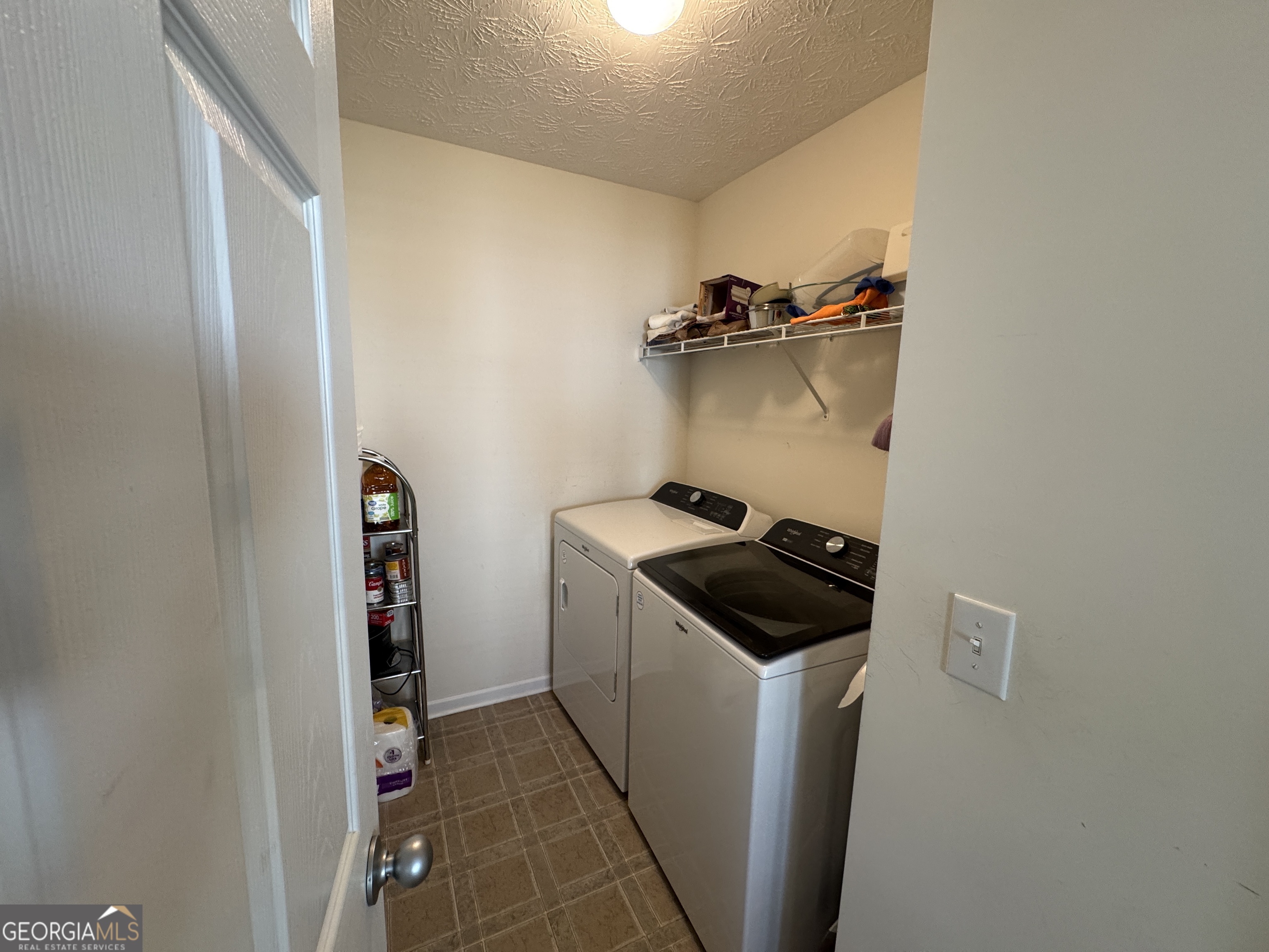 36 Windcrest Terrace Covington, GA 30016 - Photo 28 of 32 a kitchen with a stove and a refrigerator