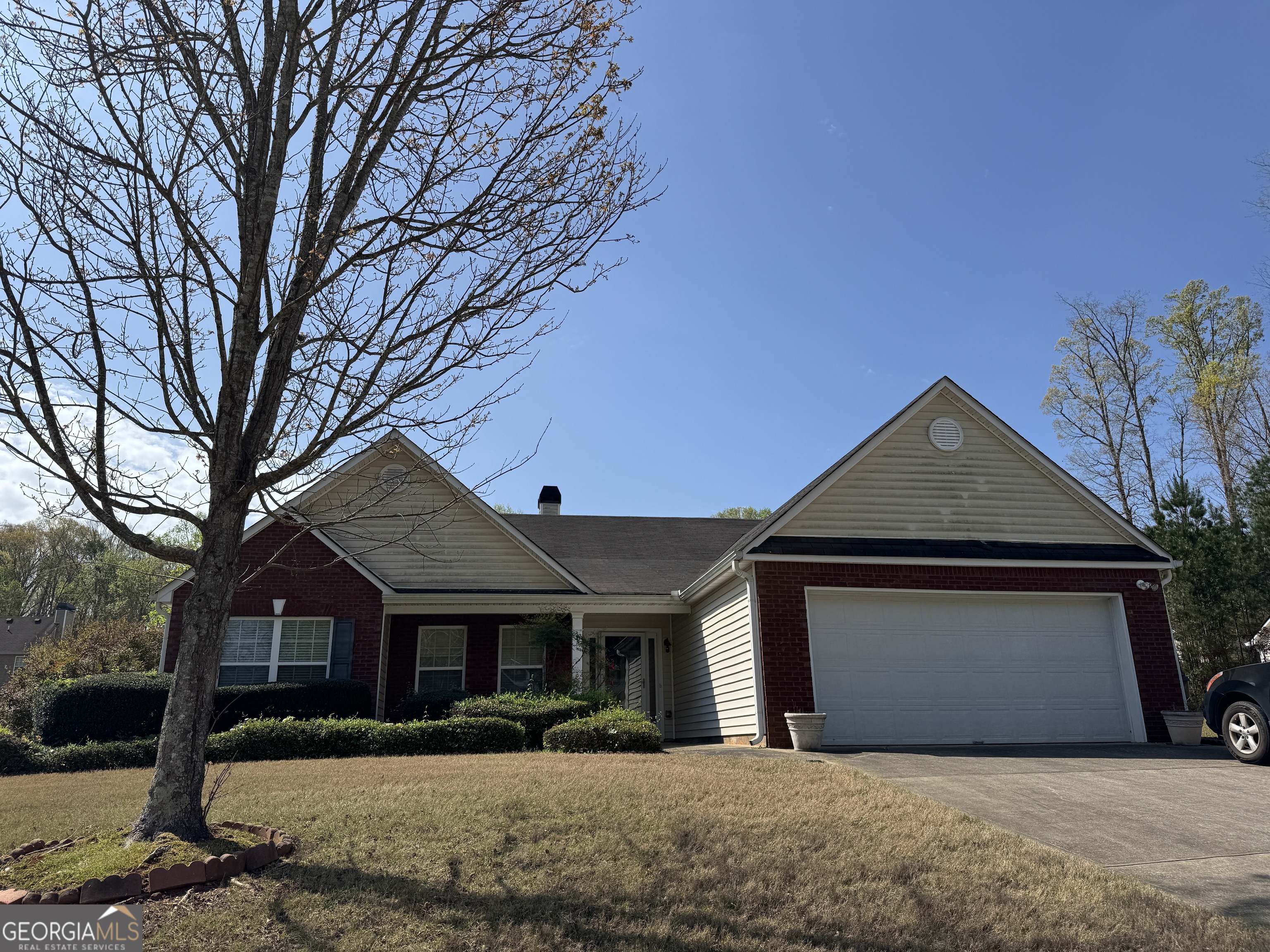 36 Windcrest Terrace Covington, GA 30016 - Photo 32 of 32 a front view of a house with a yard and garage