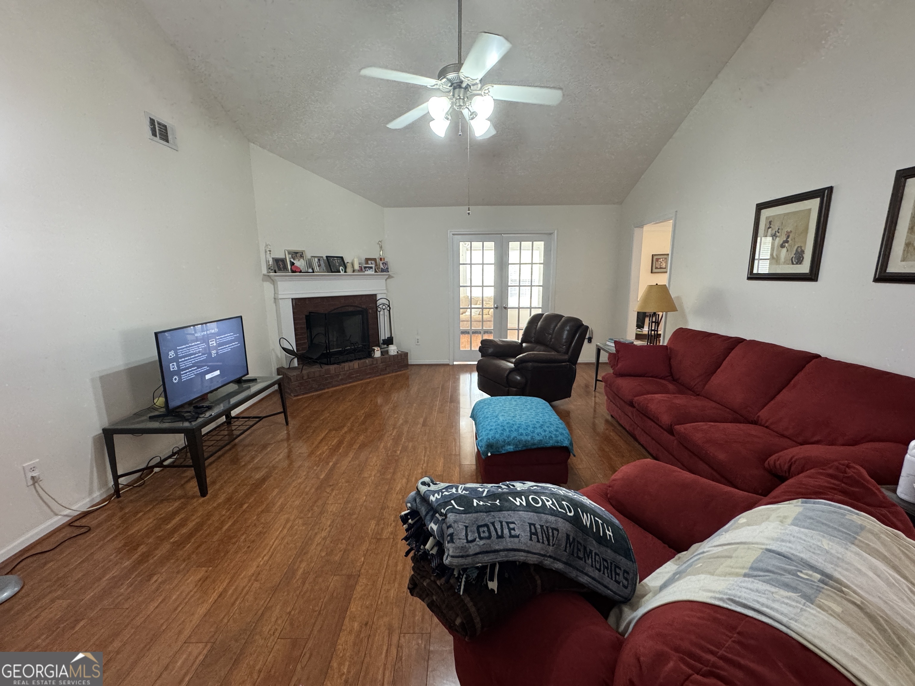 36 Windcrest Terrace Covington, GA 30016 - Photo 4 of 32 a living room with furniture fireplace and flat screen tv