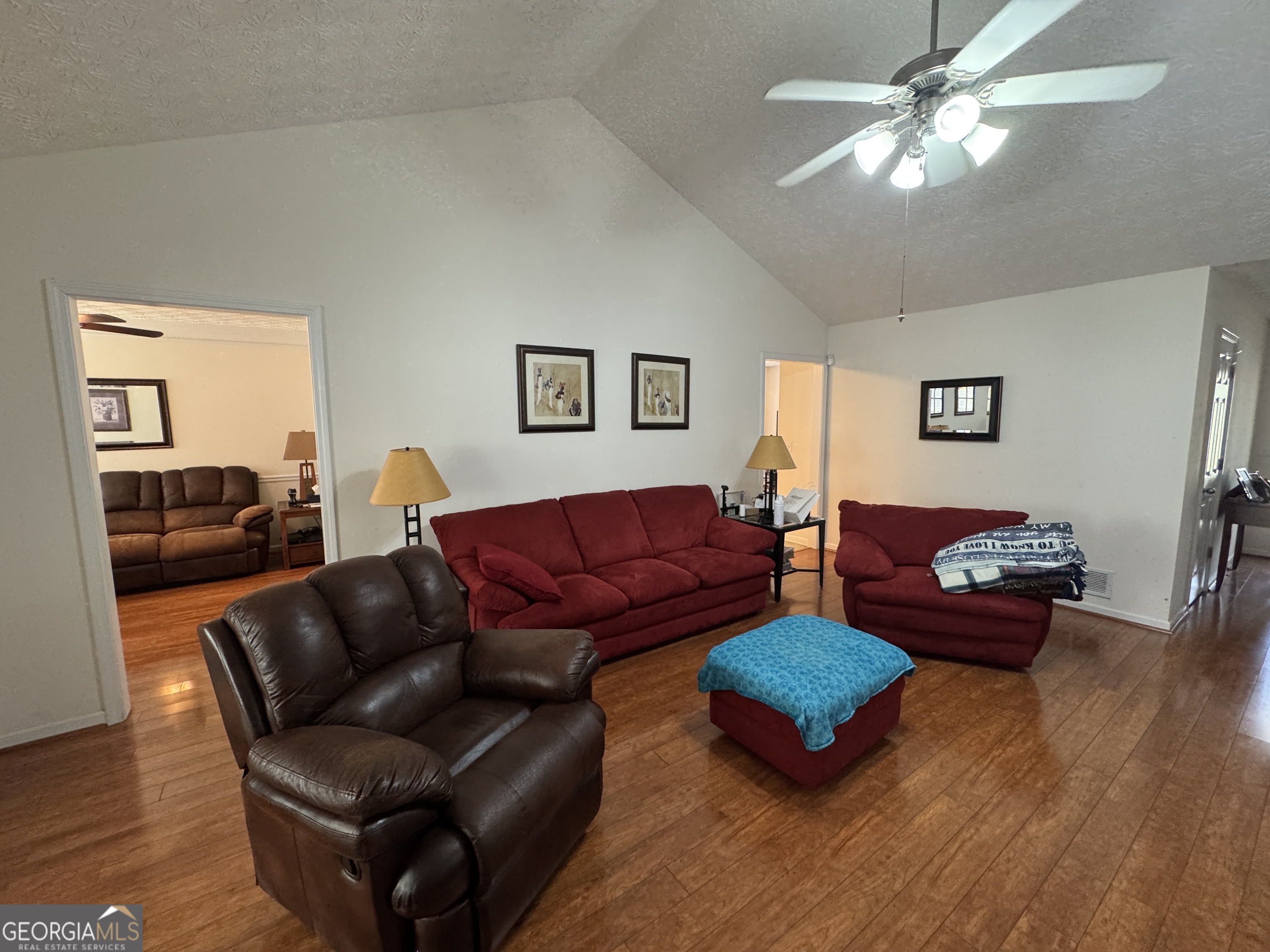 36 Windcrest Terrace Covington, GA 30016 - Photo 6 of 32 a living room with furniture a ceiling fan and a wooden floor