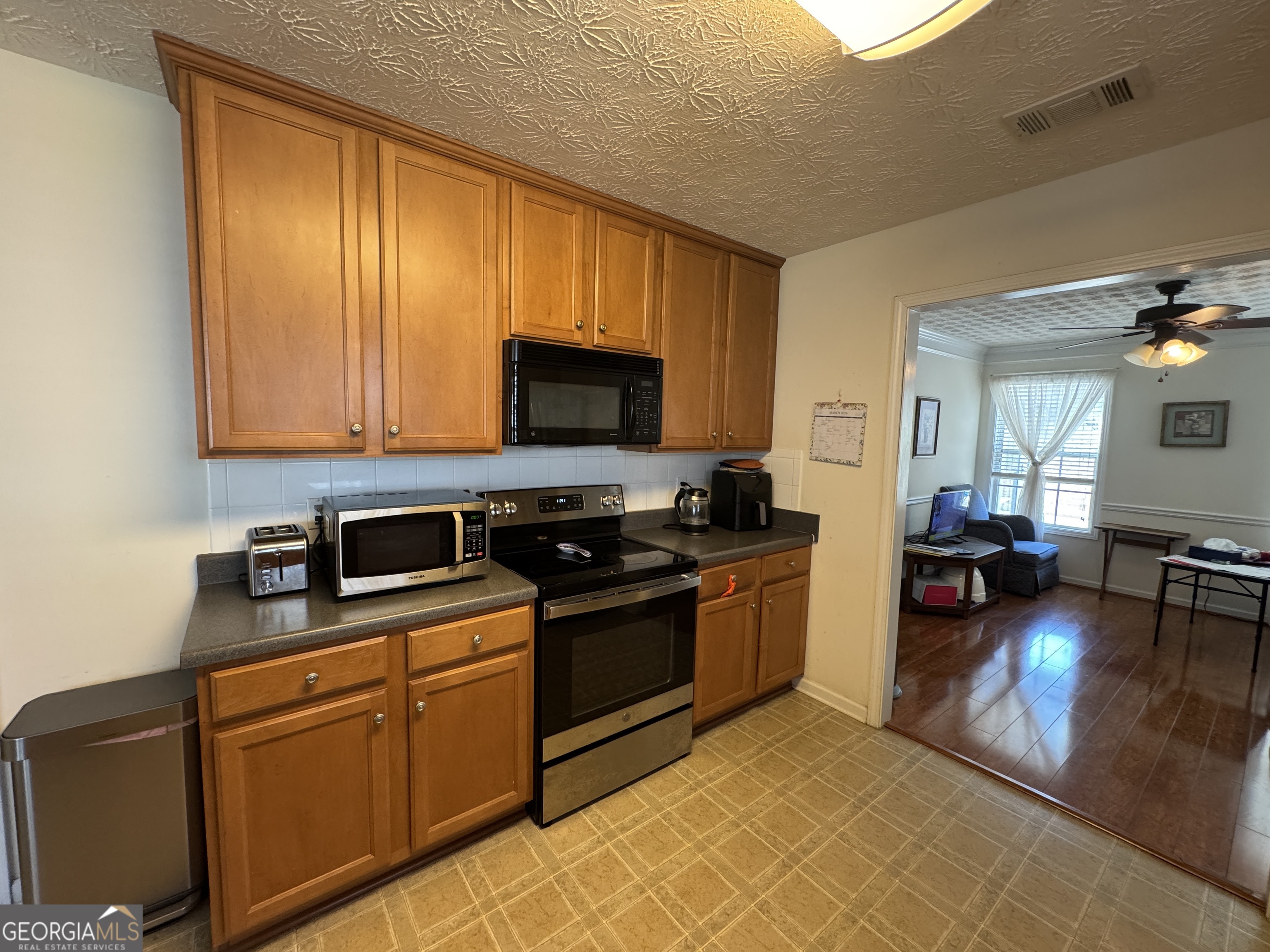 36 Windcrest Terrace Covington, GA 30016 - Photo 7 of 32 a kitchen with stainless steel appliances granite countertop a stove top oven a sink dishwasher and cabinets