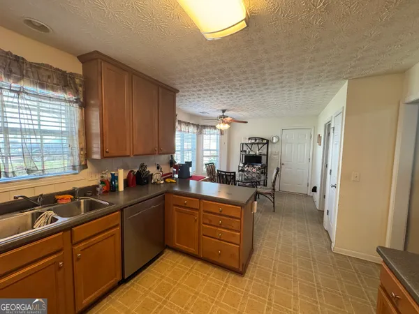 a kitchen with a sink and cabinets