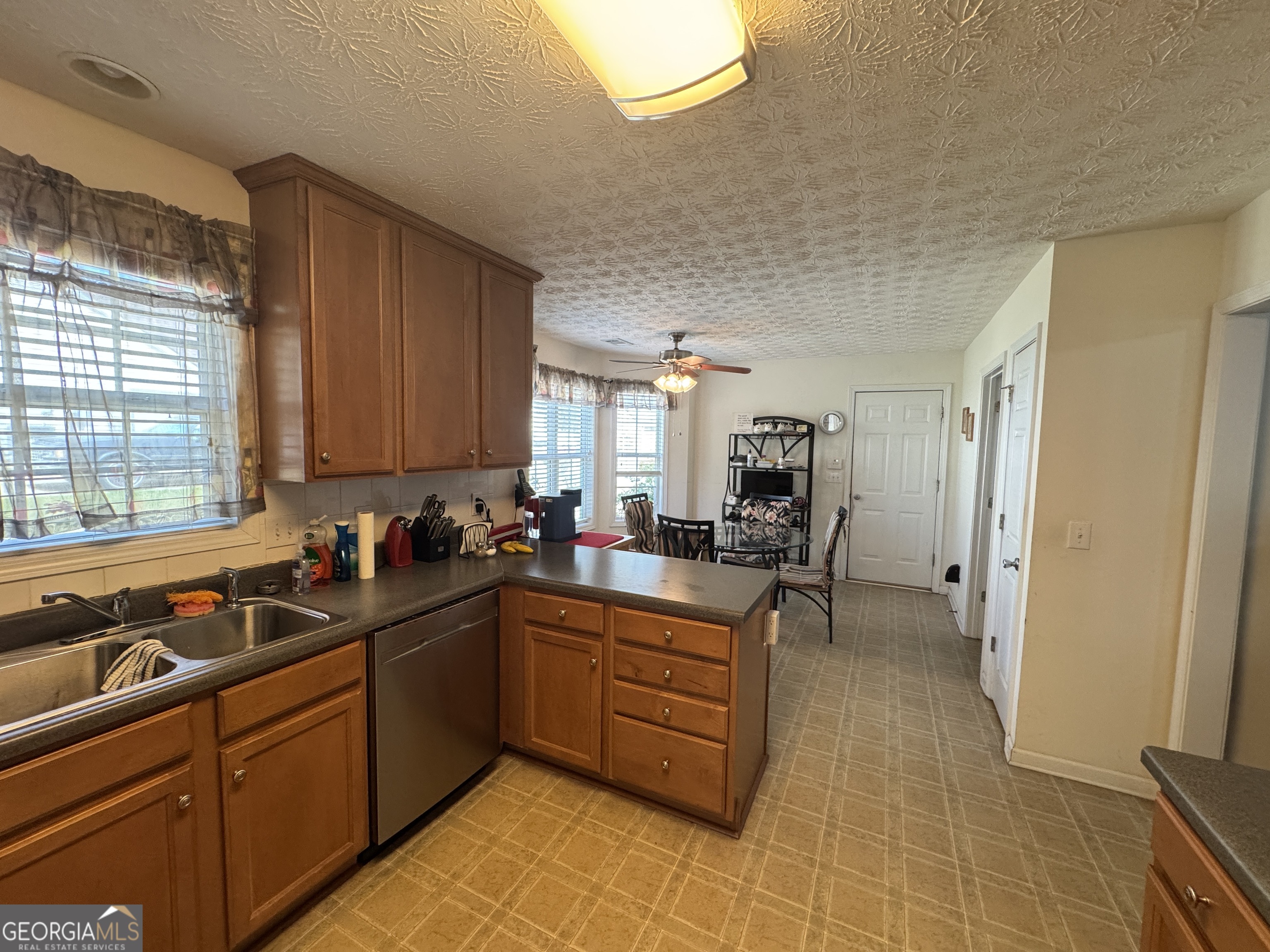 36 Windcrest Terrace Covington, GA 30016 - Photo 8 of 32 a kitchen with a sink and cabinets