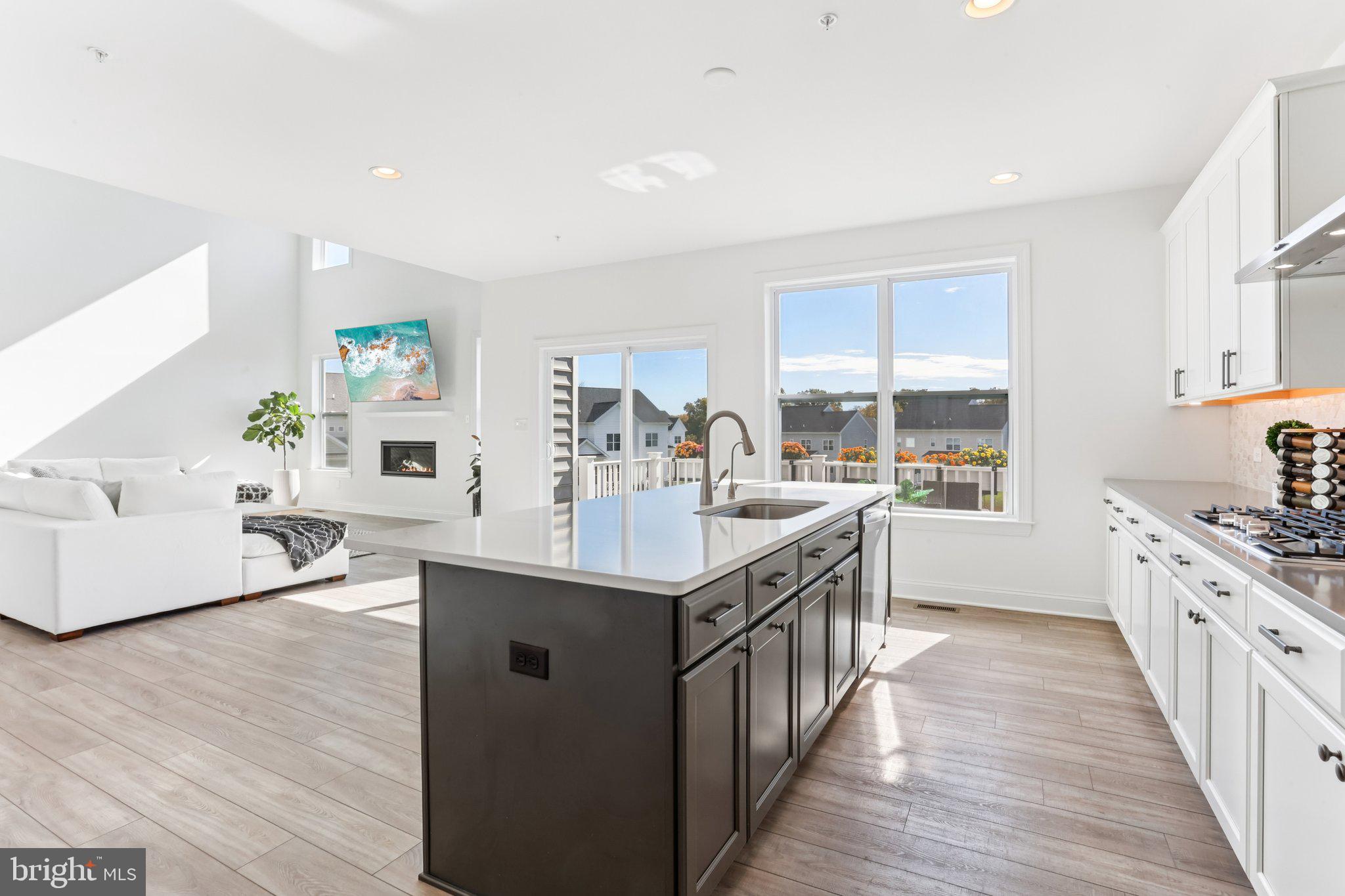 222 Grv Vly Court Chalfont, PA 18914 - Photo 13 of 46 a kitchen with stainless steel appliances granite countertop a sink stove and wooden floor